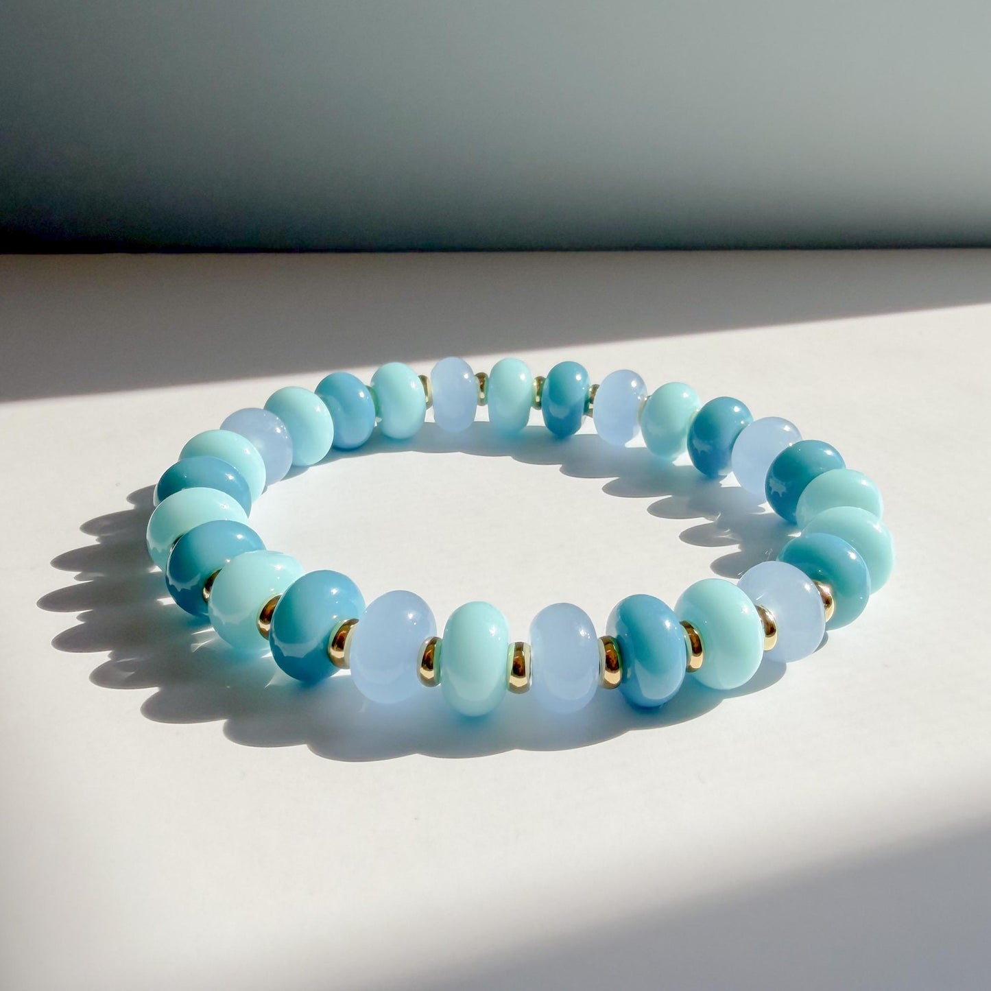 Ocean Blues Mix  | 18k Gold Filled with Blue, Soft Blue and Teal Flat Rondelle Beads | Colorful | Beaded Stretch Bracelet | Transparent bead