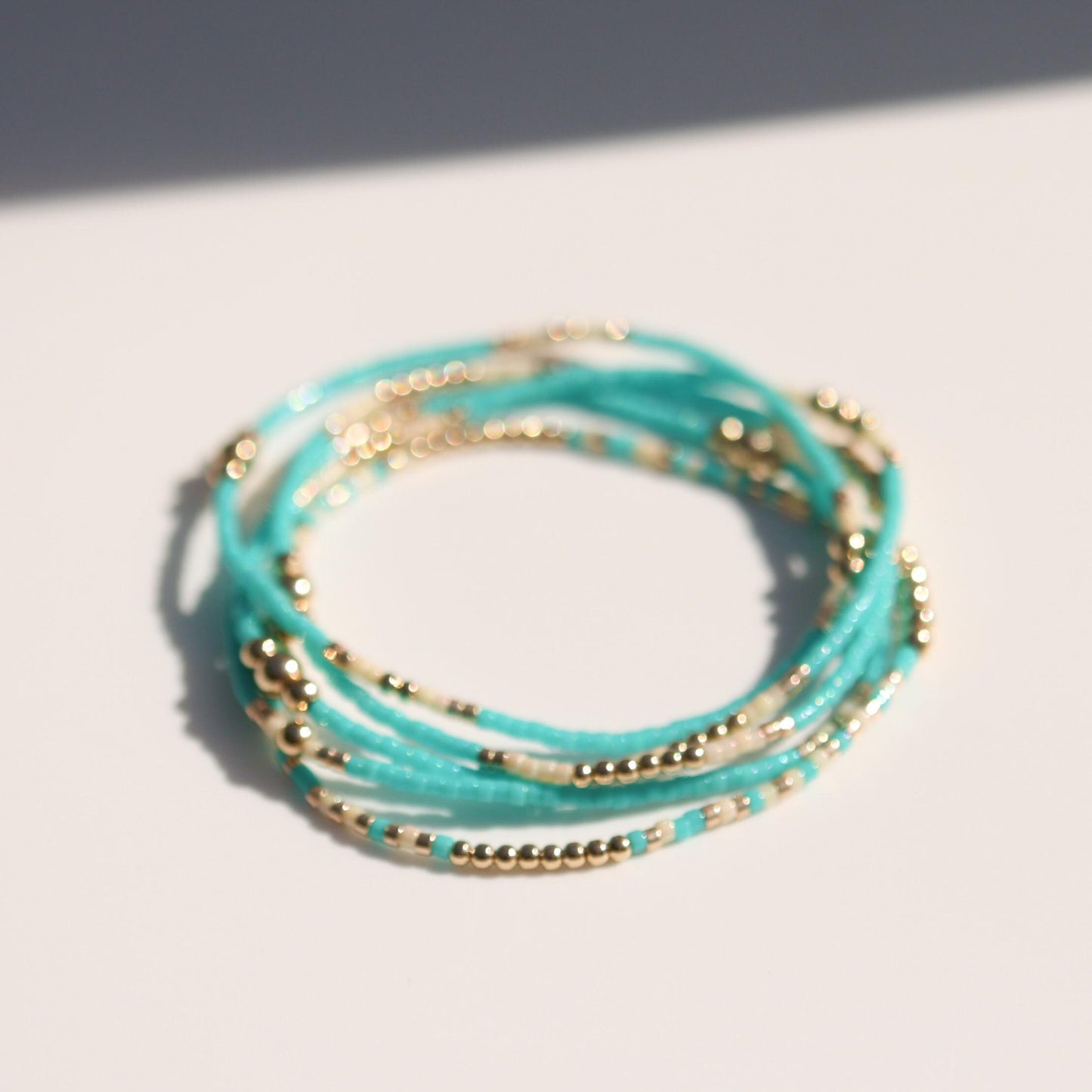 Signature Jasmine Stack | 14k Gold Filled Non-Tarnish with Teal, Cream and Gold Seed Beads | Stretch Beaded Bracelet Stack | Tiny| Triangle