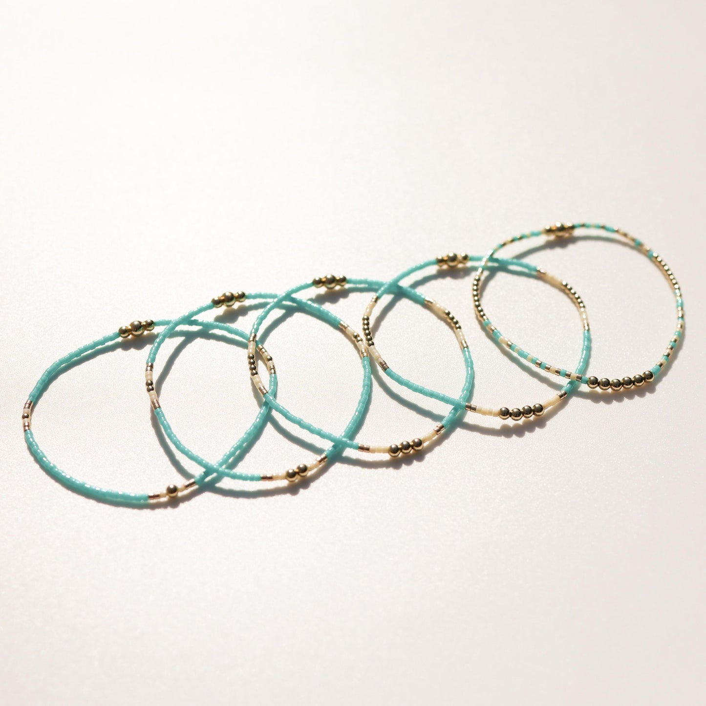Signature Jasmine Stack | 14k Gold Filled Non-Tarnish with Teal, Cream and Gold Seed Beads | Stretch Beaded Bracelet Stack | Tiny| Triangle