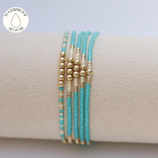 Signature Jasmine Stack | 14k Gold Filled Non-Tarnish with Teal, Cream and Gold Seed Beads | Stretch Beaded Bracelet Stack | Tiny| Triangle