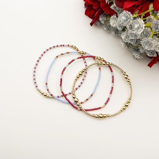 Signature Crimson Skies Stack | 14k Gold Filled Non-Tarnish Stack with Maroon and Sky Blue | Tiny Bead Trending Gold Stretch Bracelets |